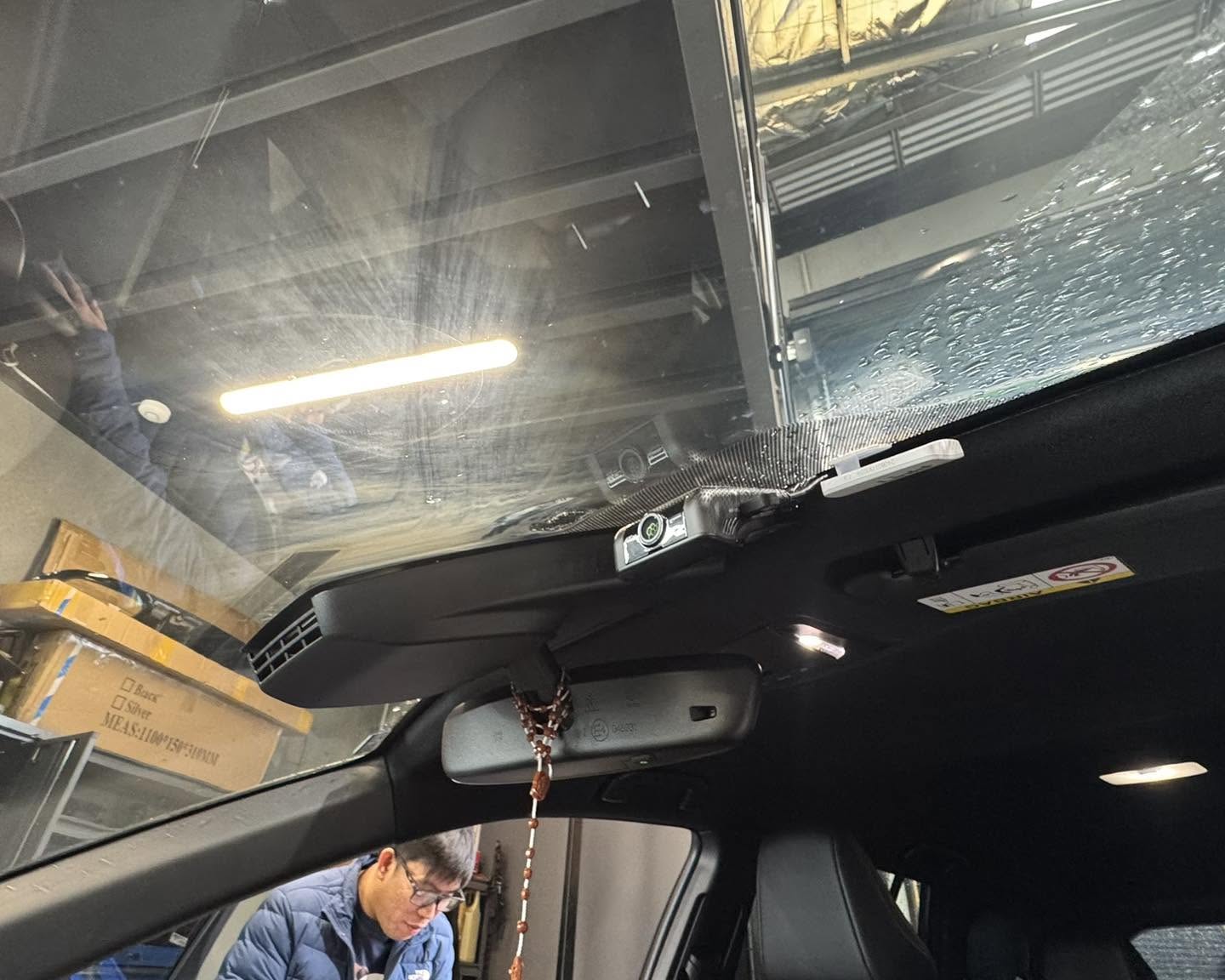 Front dash camera mounted behind the rear-view mirror with concealed wiring